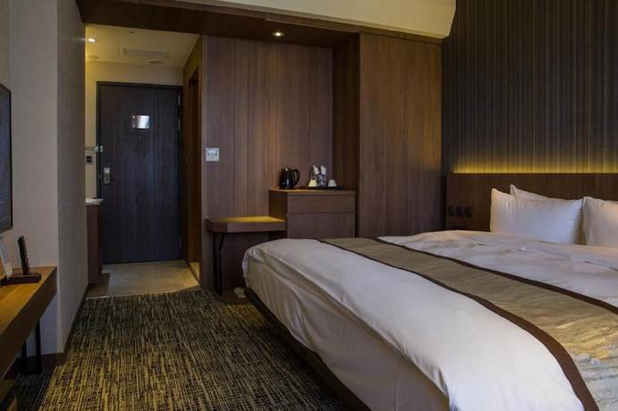 Imagen de la habitación del Hotel In, Pingzhen. Foto 12