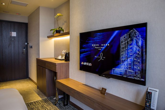 Imagen de la habitación del Hotel In, Pingzhen. Foto 15
