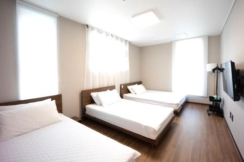 Imagen de la habitación del Hotel Incheon Airport Guest House King. Foto 17