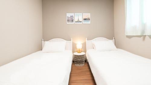 Imagen de la habitación del Hotel Incheon Airport Guest House King. Foto 18