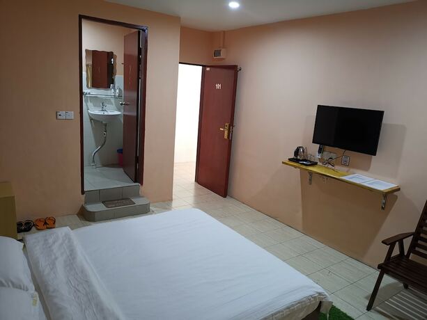 Imagen de la habitación del Hotel Indah Inn. Foto 13