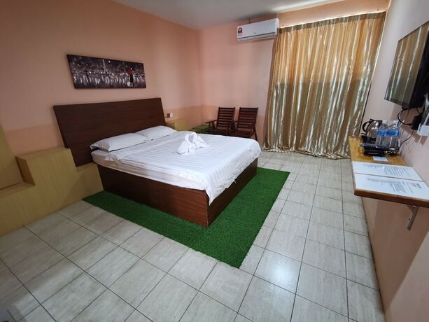 Imagen de la habitación del Hotel Indah Inn. Foto 15
