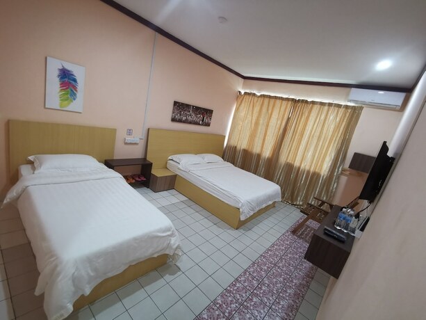 Imagen de la habitación del Hotel Indah Inn. Foto 16