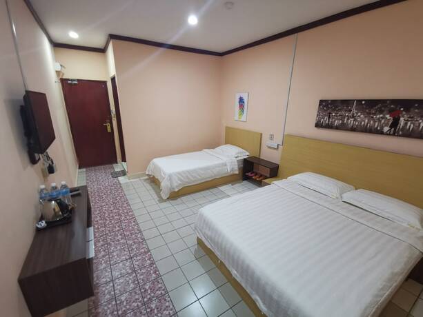 Imagen de la habitación del Hotel Indah Inn. Foto 17