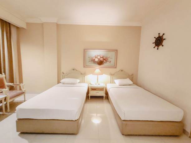 Imagen de la habitación del Hotel Indah Palace Solo. Foto 6