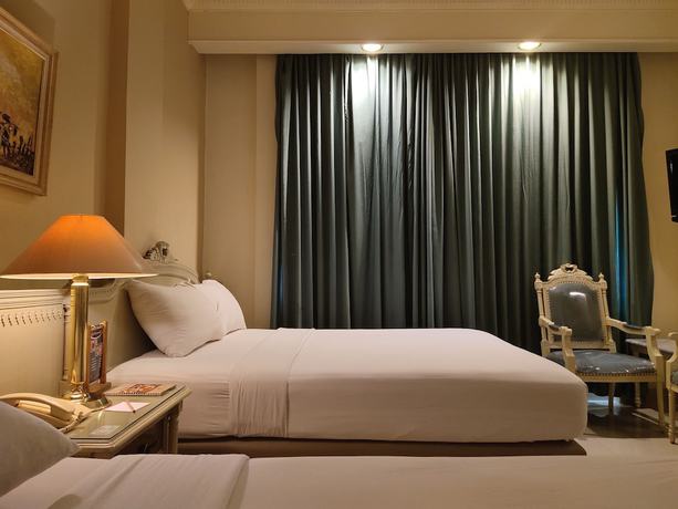 Imagen de la habitación del Hotel Indah Palace Solo. Foto 12