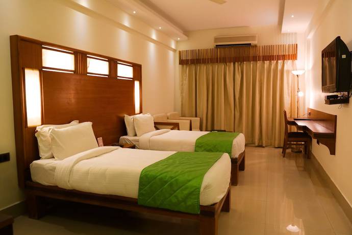 Imagen de la habitación del Hotel Inderlok, Dehradun. Foto 13