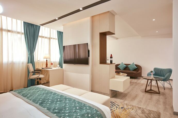 Imagen de la habitación del Hotel Indreni Suites. Foto 18
