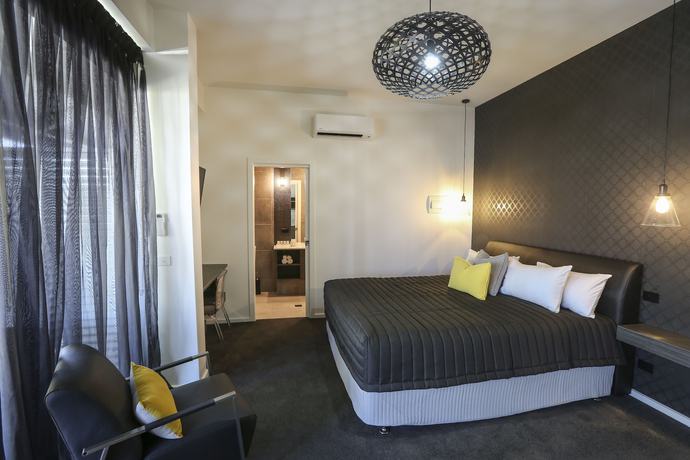 Imagen de la habitación del Hotel Indulge Apartments CBD. Foto 11