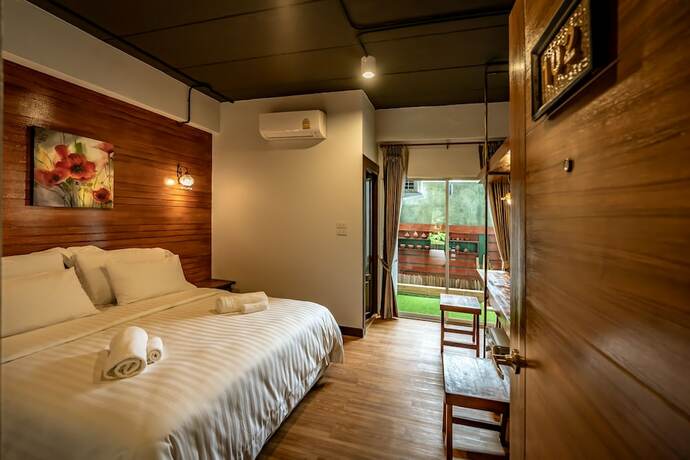 Imagen de la habitación del Hotel Ing Mon House. Foto 18