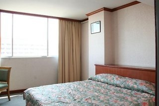 Imagen de la habitación del Hotel Inn Come Suite Bangkok. Foto 5