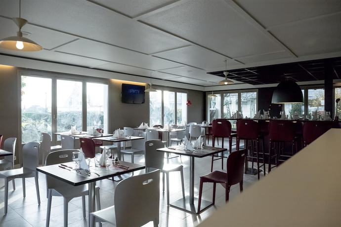 Imagen del bar/restaurante del Hotel Inn Design Laval. Foto 2