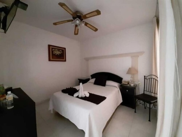 Imagen de la habitación del Hotel Inn Galerias. Foto 11