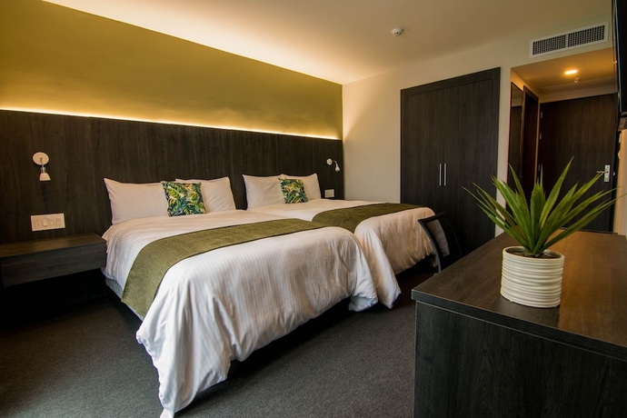 Imagen de la habitación del Hotel Innfiniti and Suites. Foto 2