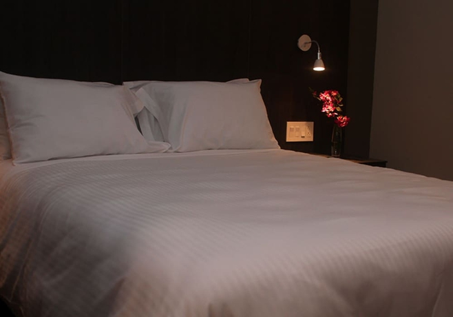 Imagen de la habitación del Hotel Innfiniti and Suites. Foto 6