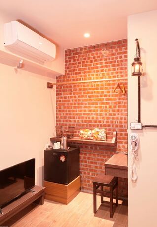 Imagen de la habitación del Hotel Inn-itiate Tainan. Foto 30