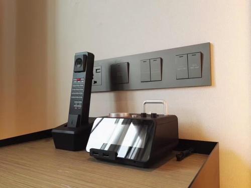 Imagen de la habitación del Hotel Innside Zhengzhou. Foto 9