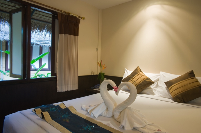 Imagen de la habitación del Hotel Inrawadee Resort. Foto 7
