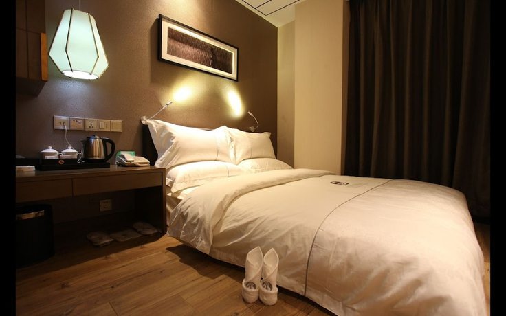 Imagen de la habitación del Hotel Insail Hotels (Zhongshanba Subway Station Guangzhou). Foto 6