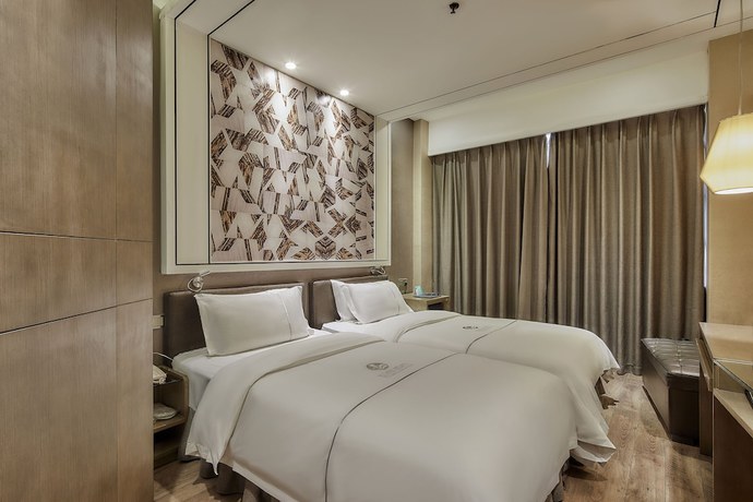 Imagen de la habitación del Hotel Insail Hotels (Zhongshanba Subway Station Guangzhou). Foto 10