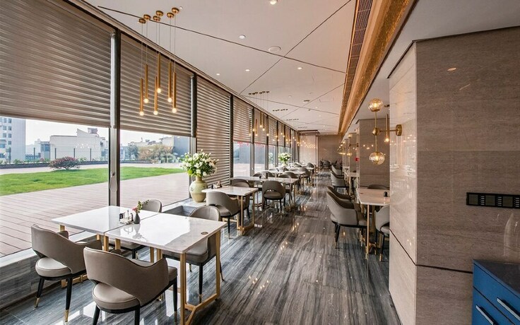 Imagen del bar/restaurante del Hotel Int Landison Plaza Jinhua. Foto 7