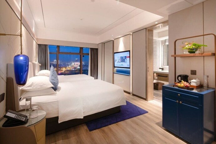 Imagen de la habitación del Hotel Int Landison Plaza Jinhua. Foto 11