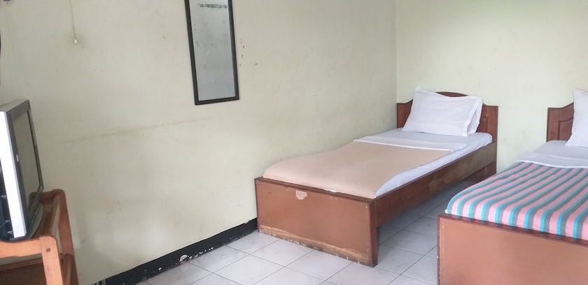 Imagen de la habitación del Hotel Intan Purwakarta. Foto 14