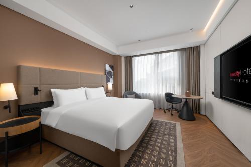 Imagen de la habitación del Hotel Intercity Guangzhou Pazhou Convention & Exhibition. Foto 18