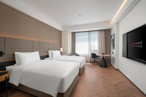 Imagen de la habitación del Hotel Intercity Guangzhou Pazhou Convention & Exhibition. Foto 20