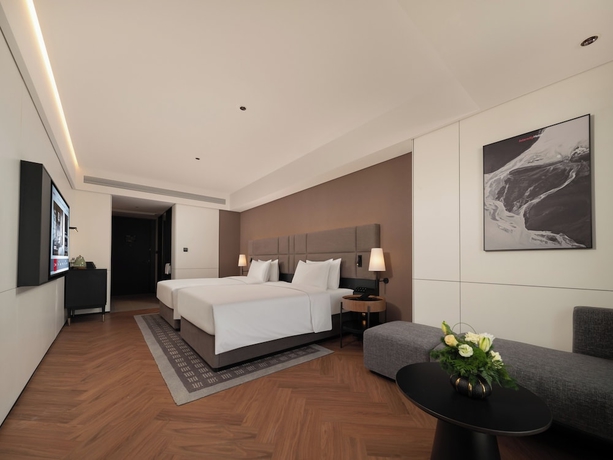 Imagen de la habitación del Hotel Intercity Qingdao Downtown. Foto 7