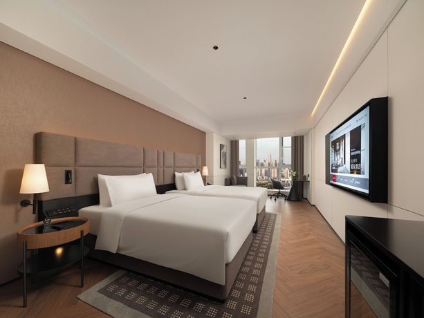 Imagen de la habitación del Hotel Intercity Qingdao Downtown. Foto 8