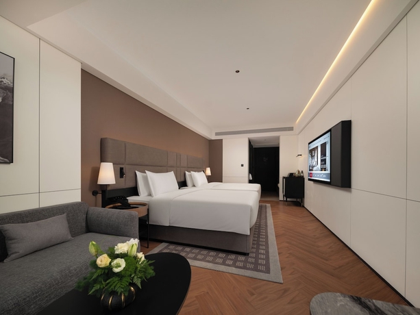 Imagen de la habitación del Hotel Intercity Qingdao Downtown. Foto 9