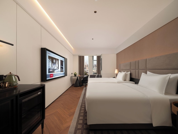Imagen de la habitación del Hotel Intercity Qingdao Downtown. Foto 14