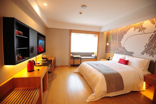 Imagen de la habitación del Hotel Intercity Qingdao. Foto 7