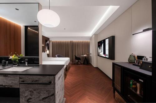 Imagen de la habitación del Hotel Intercity Shantou CHJ. Foto 19