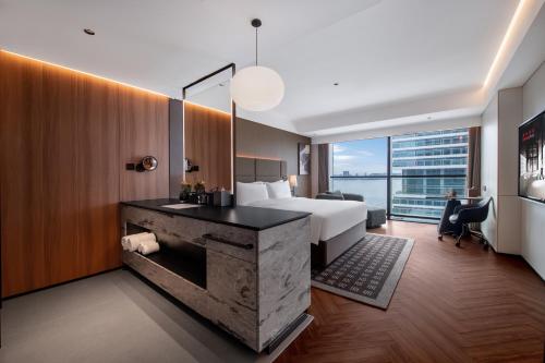 Imagen de la habitación del Hotel Intercity Shantou CHJ. Foto 20