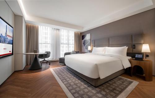 Imagen de la habitación del Hotel Intercity Wuhan CADE Optics Valley. Foto 19