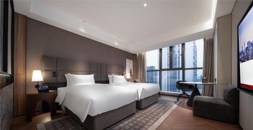 Imagen de la habitación del Hotel Intercity Wuhan CADE Optics Valley. Foto 20