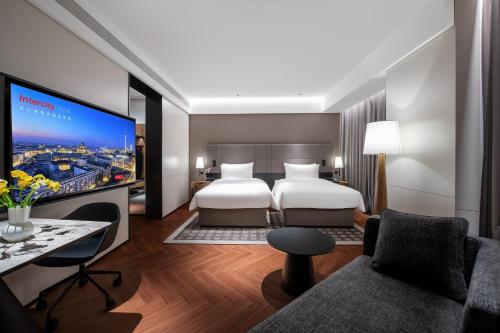 Imagen de la habitación del Hotel Intercity Wuhan Guanshan Avenue. Foto 19