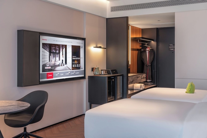 Imagen de la habitación del Hotel Intercity Yantai Downtown. Foto 4