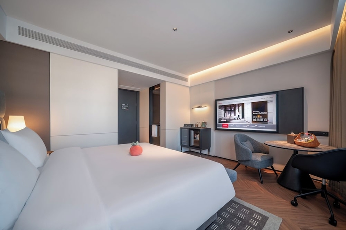 Imagen de la habitación del Hotel Intercity Yantai Downtown. Foto 9