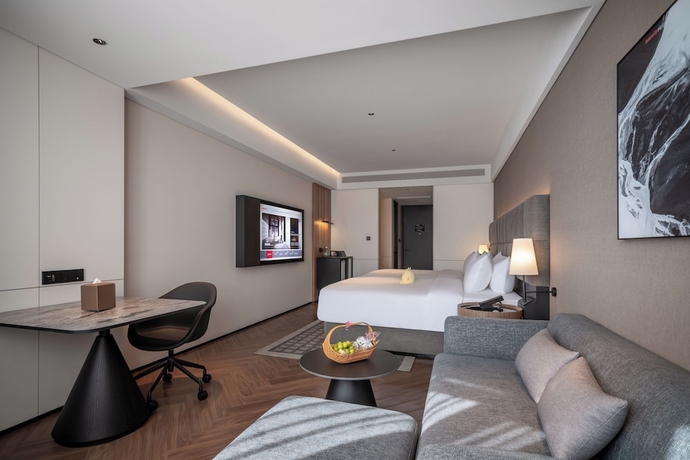 Imagen de la habitación del Hotel Intercity Yantai Downtown. Foto 12