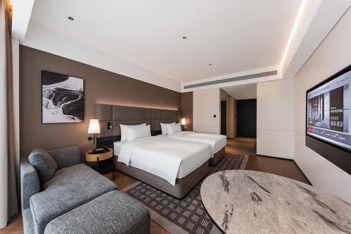Imagen de la habitación del Hotel Intercity Yantai Hi-tech Zone. Foto 2