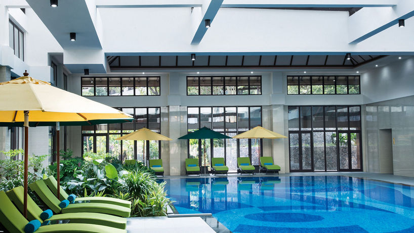 Imagen de la piscina del Hotel Intercontinental Xishuangbanna Resort. Foto 16
