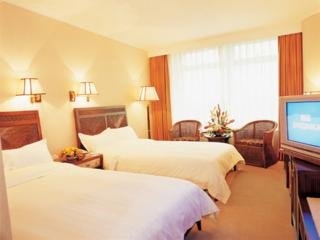 Imagen de la habitación del Hotel International Bamboo and Rattan Tower. Foto 4