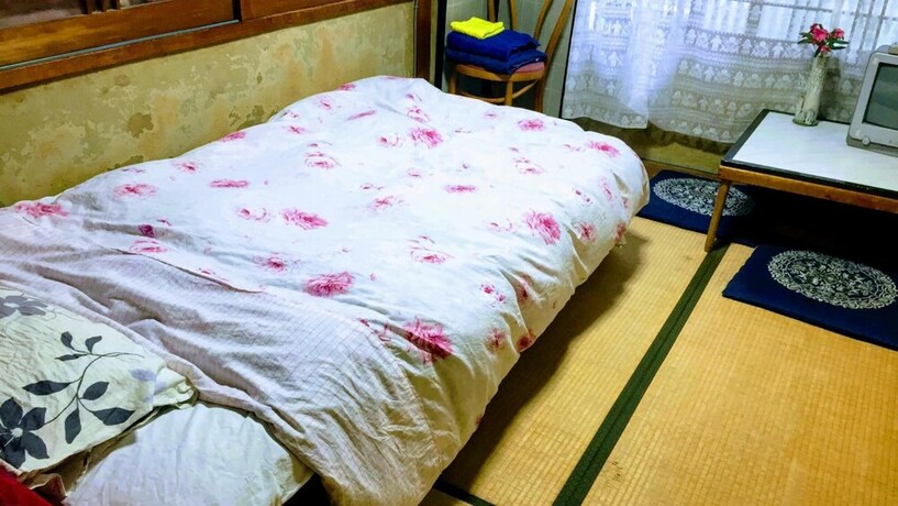 Imagen de la habitación del Hotel International Guest House Tani House. Foto 21