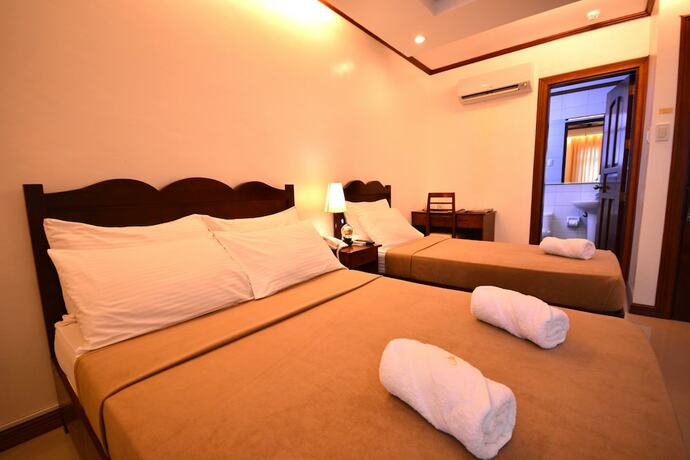 Imagen de la habitación del Hotel Ipil Suites Puerto Princesa. Foto 12