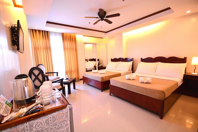 Imagen de la habitación del Hotel Ipil Suites Puerto Princesa. Foto 15
