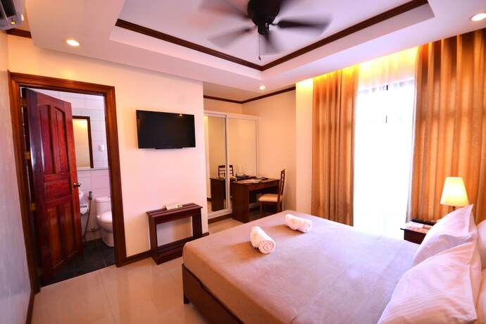 Imagen de la habitación del Hotel Ipil Suites Puerto Princesa. Foto 16