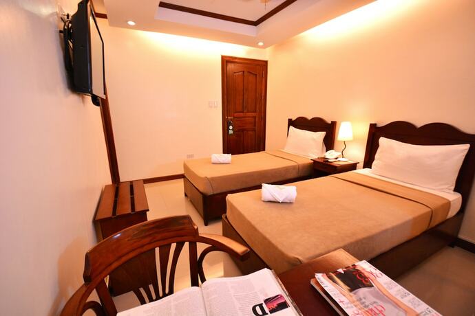 Imagen de la habitación del Hotel Ipil Suites Puerto Princesa. Foto 17